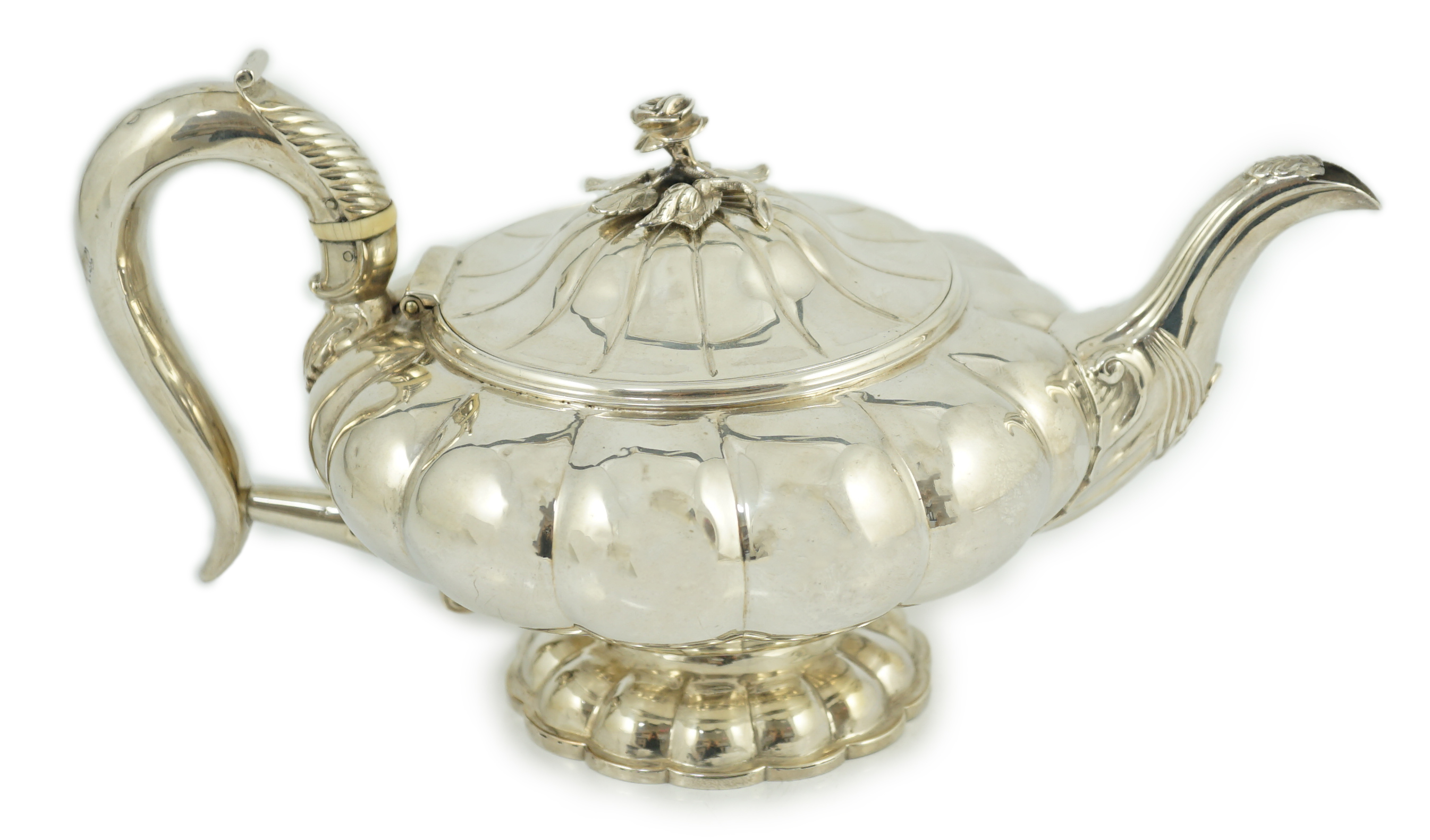 A George IV silver melon shaped pedestal teapot, by Joseph Angell I